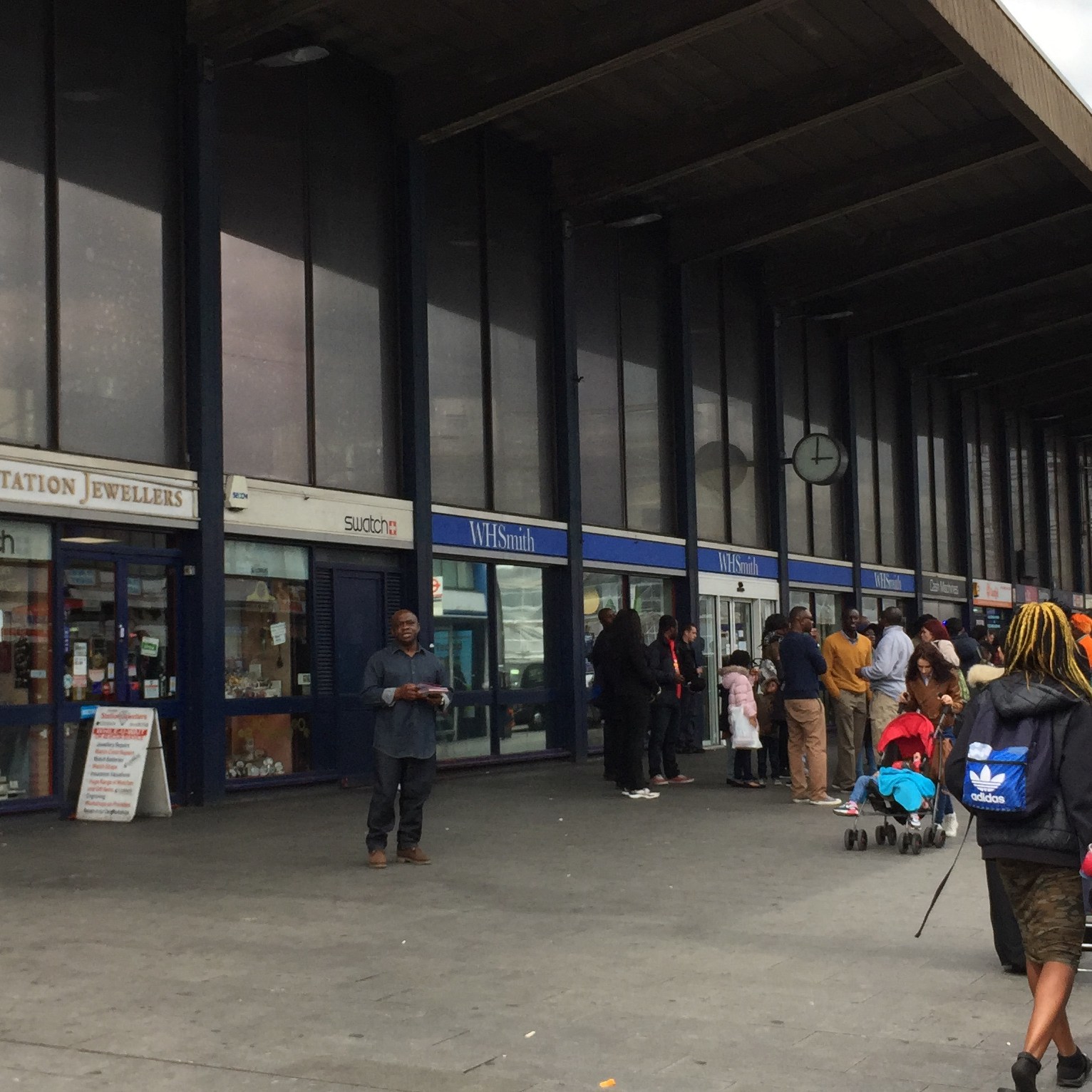 Close-up of the outside of Barking Station, including a station jewellers and a branch of WH Smith.
