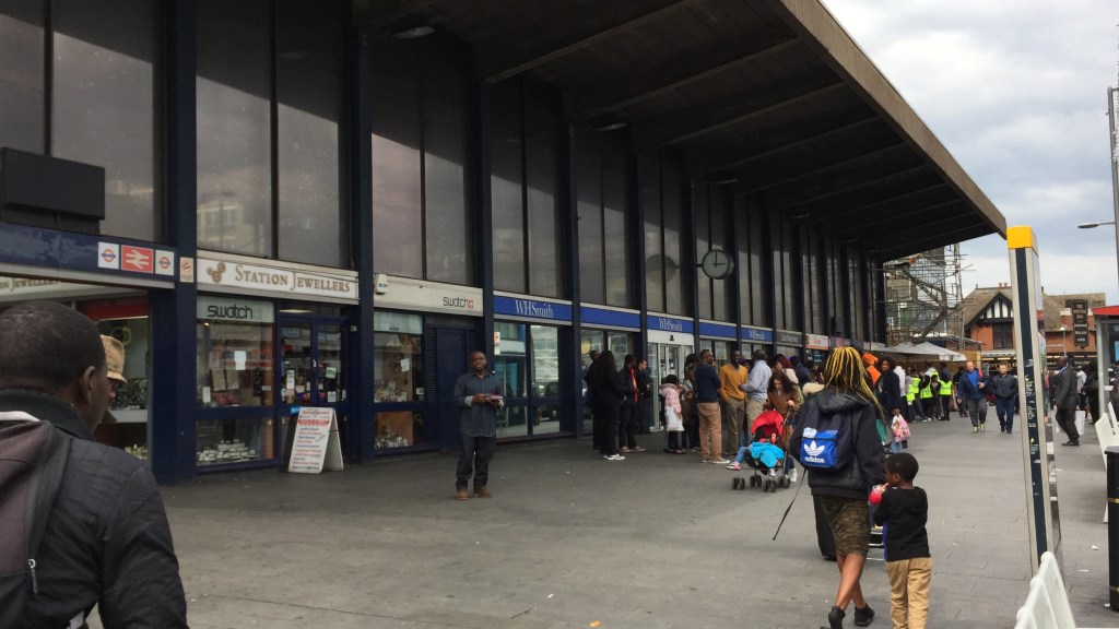 Close-up of the outside of Barking Station, including a station jewellers and a branch of WH Smith.