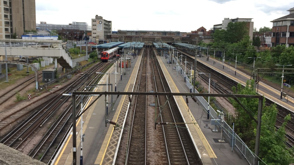 Overhead view from a bridge of the railway tracks and platforms at Barking Station.