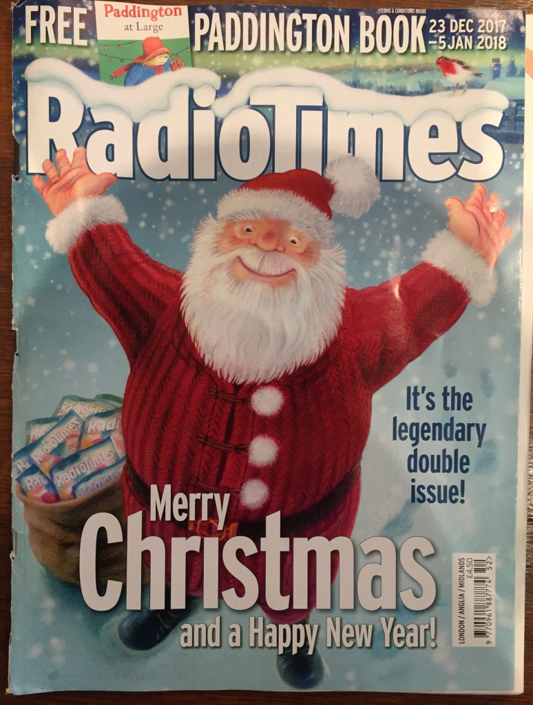 The Christmas edition of the Radio Times magazine, with a cover picture of Santa Claus smiling and holding up his arms in celebration, above the text Merry Christmas and a Happy New Year