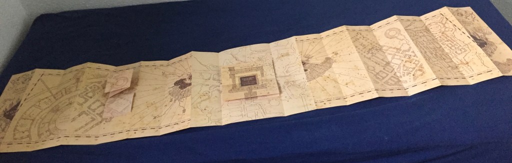 The Marauder's Map of Hogwarts, fully unfolded so that it takes up the length of my bed.