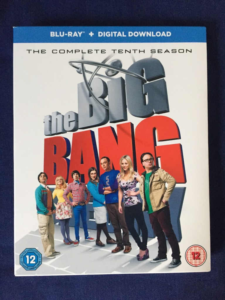 Blu-ray case for The Big Bang Theory, the complete 10th season. Shows the gang standing in front of the huge logo for the show, against a white background.