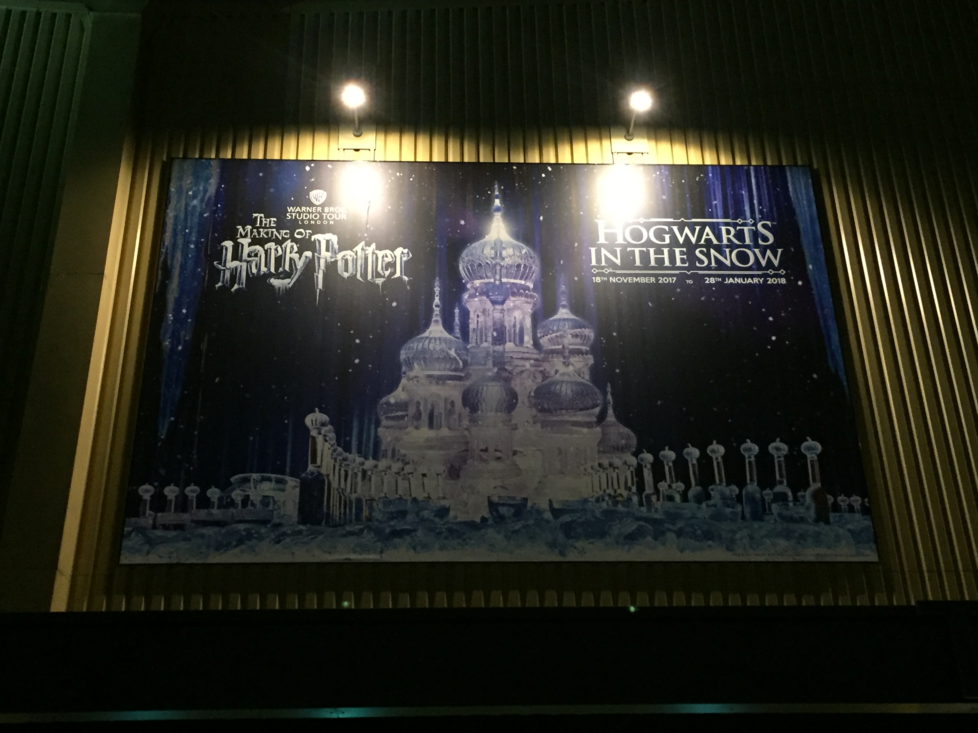 Poster of a big ice castle sculpture in front of a starry night sky. The top left of the poster has the Making Of Harry Potter Logo, while the top right has the text Hogwarts In The Snow.