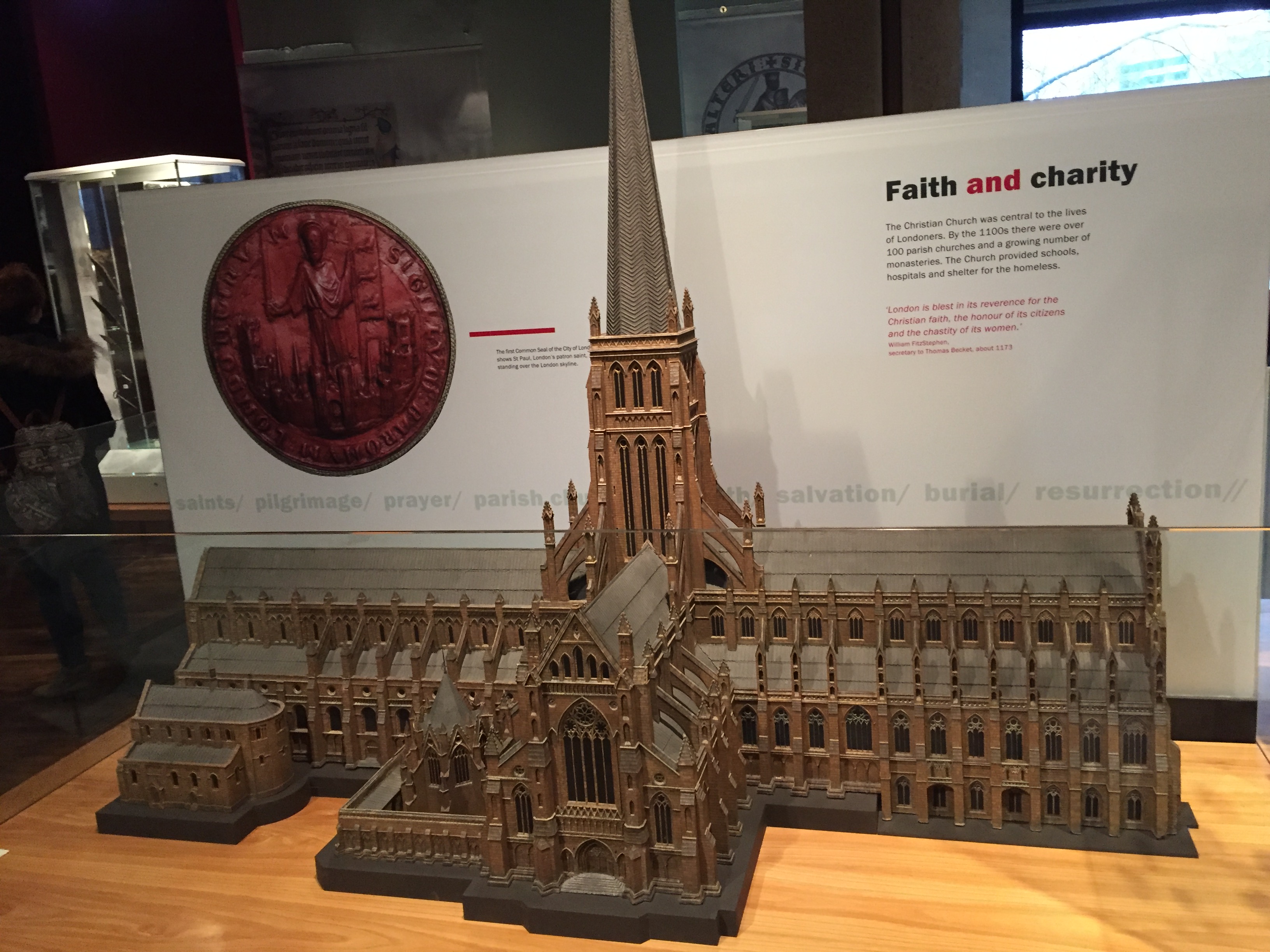 The original St Paul's Cathedral, looking like a long abbey or church with a tall spire in the centre instead of the domed roof we know today.