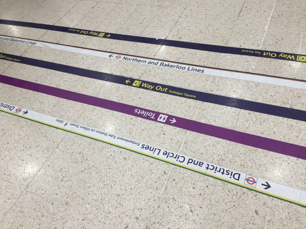 Coloured lines on the floor at Charing Cross station, which you can follow to find the toilets, the Underground or the way out.