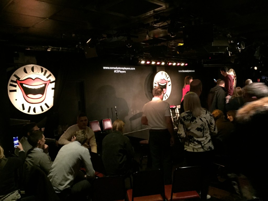 The audience and stage at The comedy Store