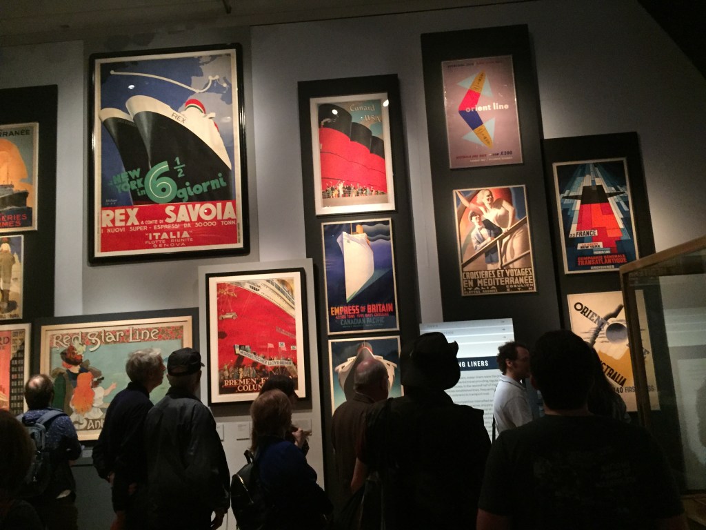 Colourful and artistic posters promoting cruise liners in various languages.
