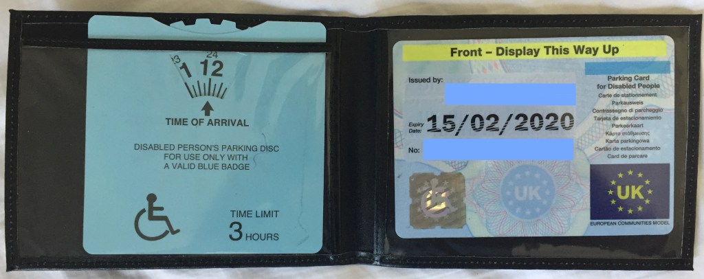 Blue Badge for disability parking, plus blue timer card with a clock face inside that can be rotated.