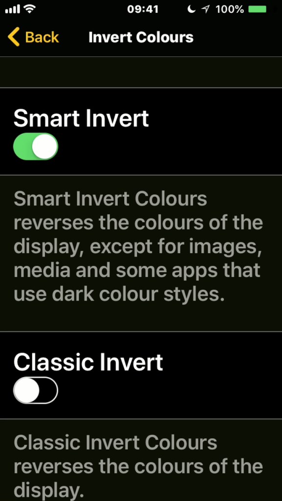 iPhone screenshot of the Invert Colours menu, with options for Smart Invert, where it inverts everything except media like photos and videos, and Classic Invert, where it inverts everything.