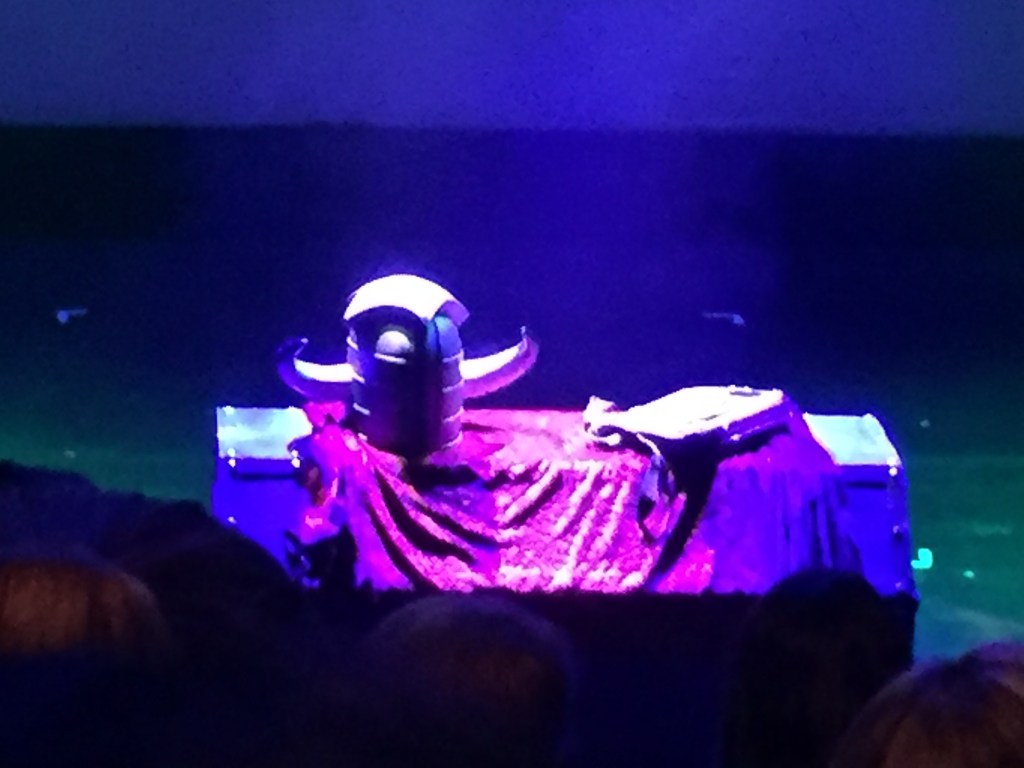 Close-up of the dungeoneer's helment and knapsack on the table on stage for Knightmare Live