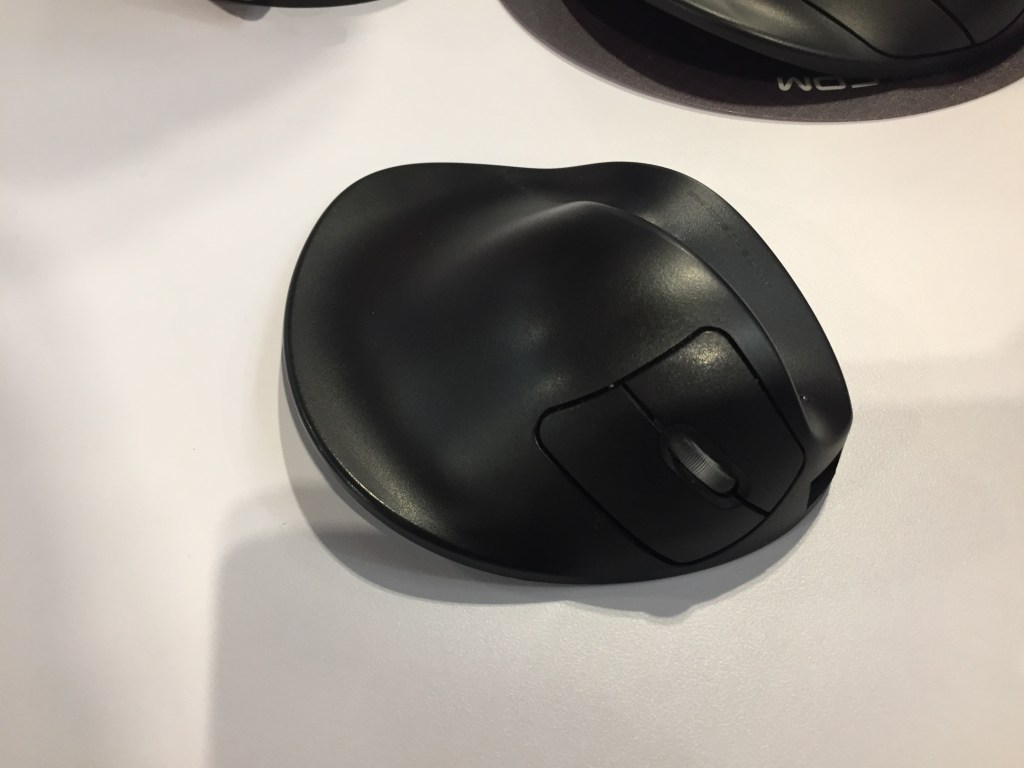 The HandShoe Mouse, larger than a standard computer mouse so you can rest your entire hand and fingers on it for full support.