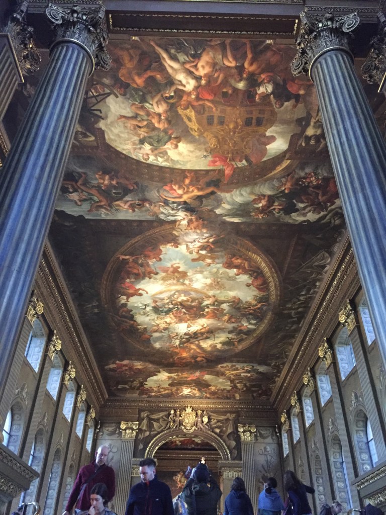 The highly detailed and ornate painted ceiling, stretching the length of the long hall in the Old Royal Naval College.