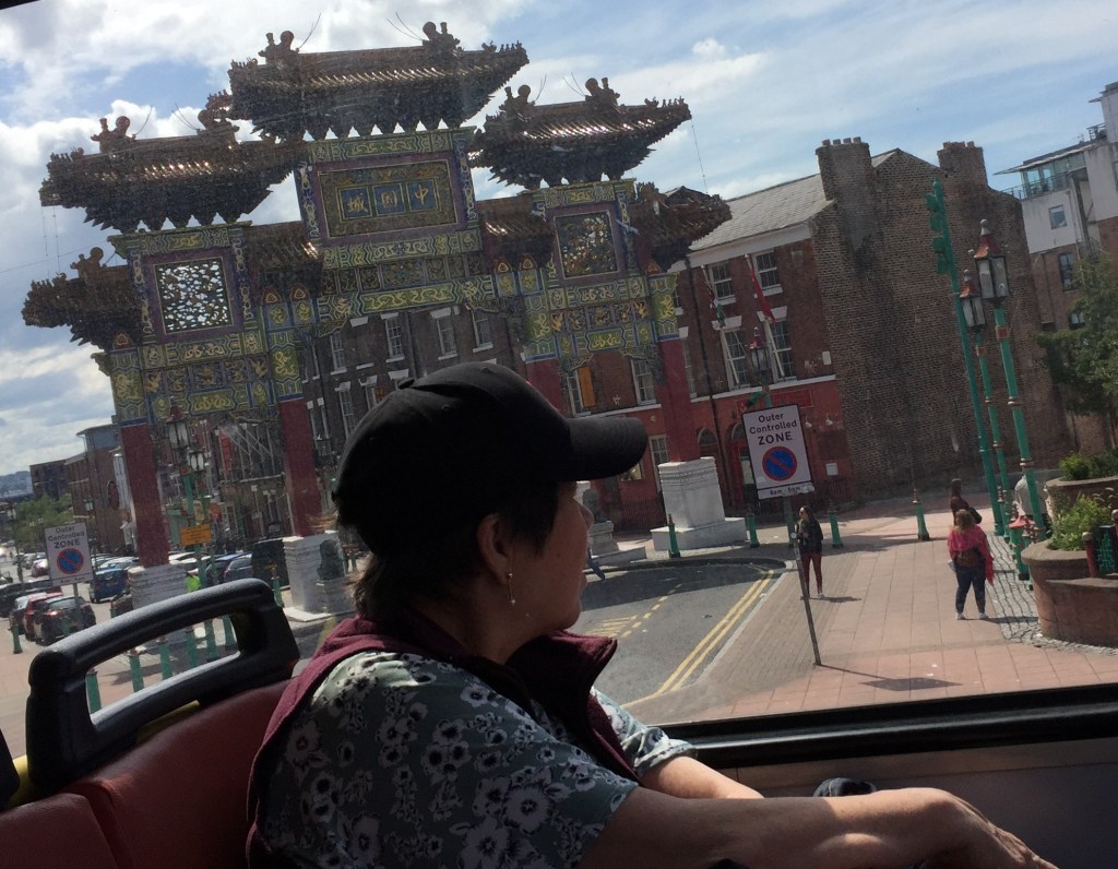 The large, tall and colourful Chinese Arch in Liverpool, decorated very ornately with symbols of Chinese culture.