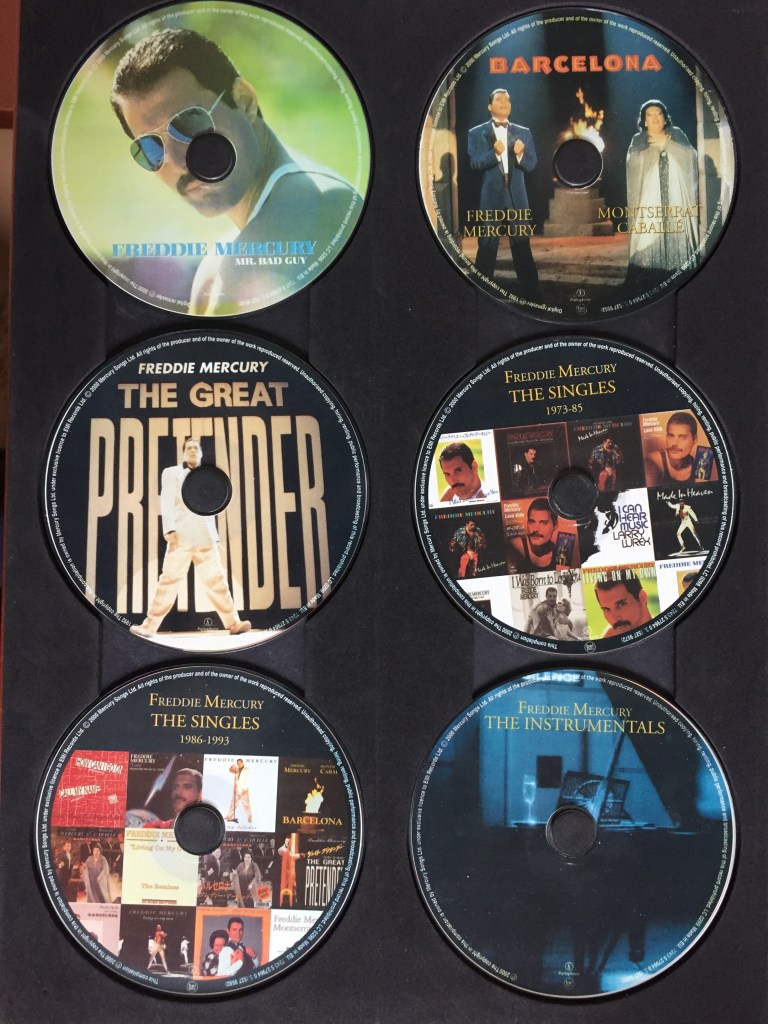 The first 6 discs in the Freddie Mercury Solo Collection, 1 disc each for the Mr. Bad Guy, Barcelona and Great Pretender albums, 2 discs for the singles, and a disc of instrumentals. The 3 album discs have the album artwork on them, the singles discs each have a collage of the single covers, and the instrumentals disc has a photo of a piano on it.