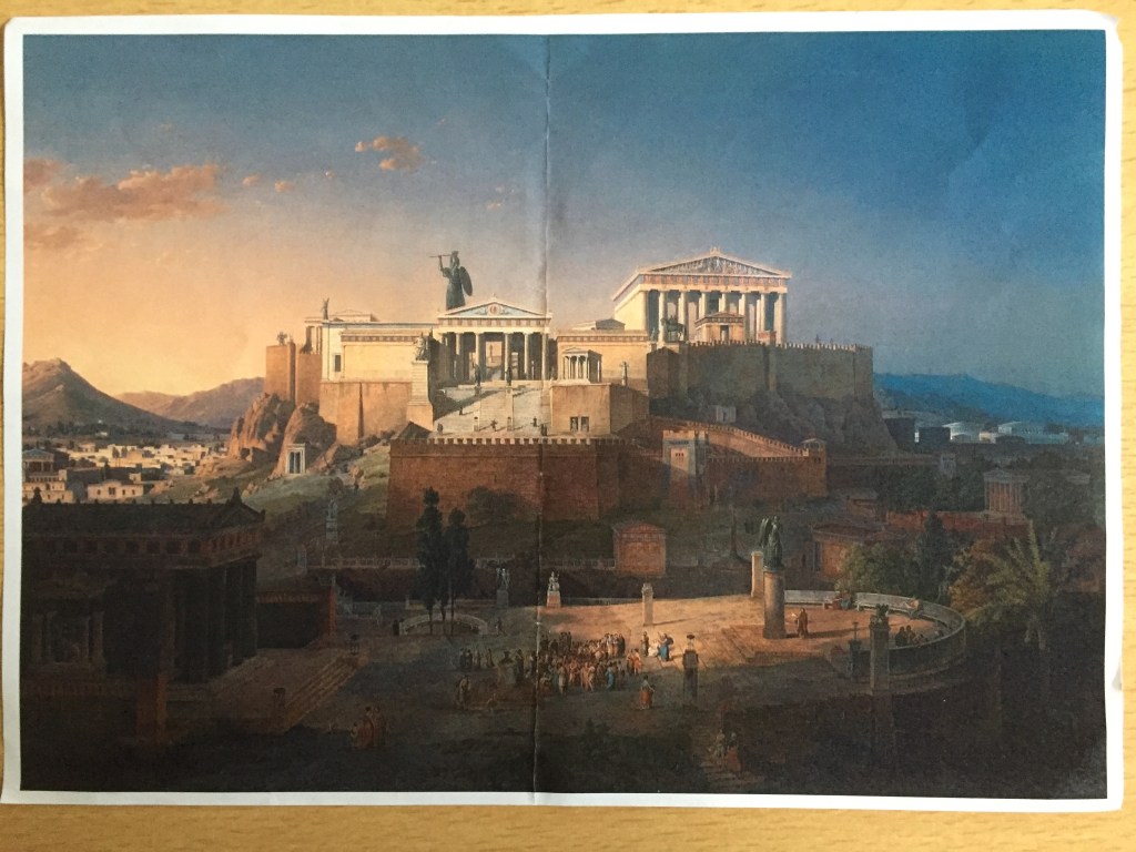 Colour photocopy of a painting by Leo von Klenze, showing the Parthenon and a similar but smaller building next to it. They are built high above a large area of land with a curved edge, in which a group of people are gathered between a building on the left and a statue on the right.