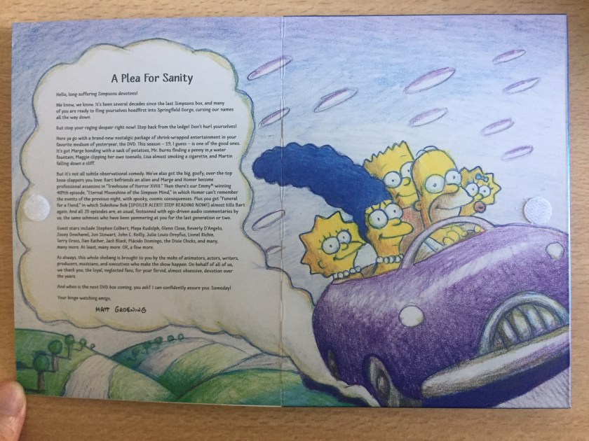 The interior of the Simpsons Season 19 DVD cover, featuring a letter to the fans by Matt Groening entitled A Plea For Sanity. Next to that is a hand-drawn and painted image of the Simpson family smiling happily as they zoom along in their car.