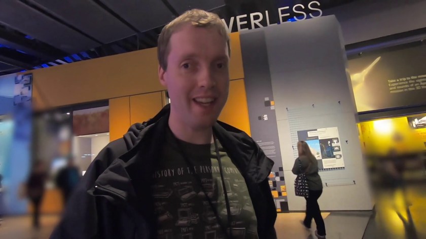 Glen smiling at the camera while in the Driverless exhibition at the Science Museum.