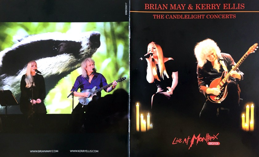 Front and back cover spread of the Blu-ray booklet for The Candlelight Concerts, showing Kerry Ellis and Brian May sitting on stools as they perform on stage. The front cover shows candles around them, while the back cover has a badger on the large video screen behind them.