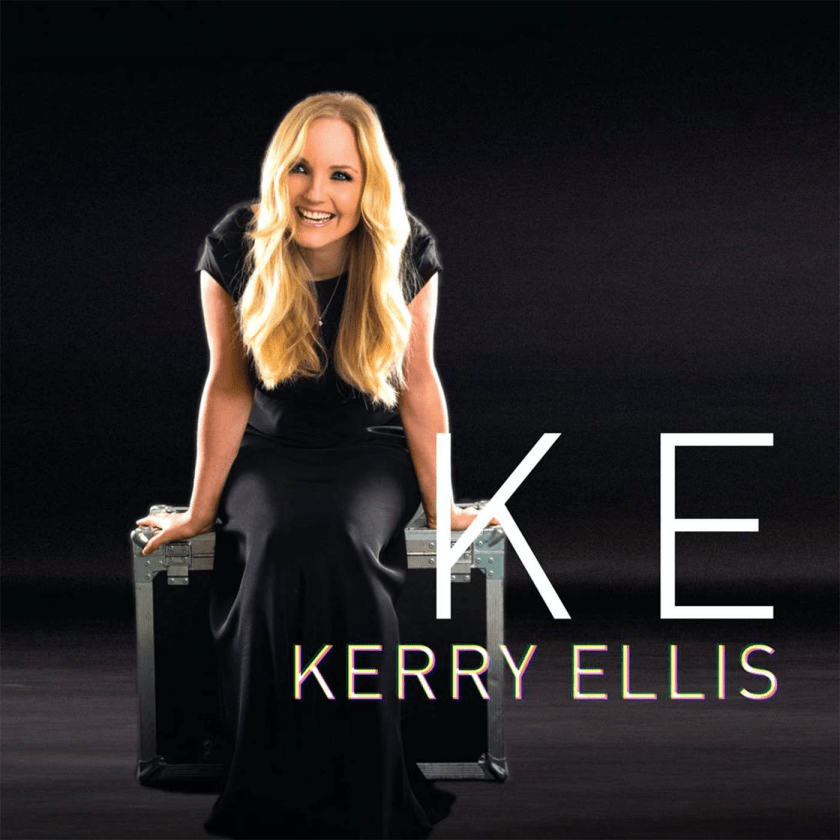 Cover for the self-titled album by Kerry Ellis, showing the blonde singer smiling widely, dressed in a black outfit apart from her bare arms, sitting on a large metal trunk.