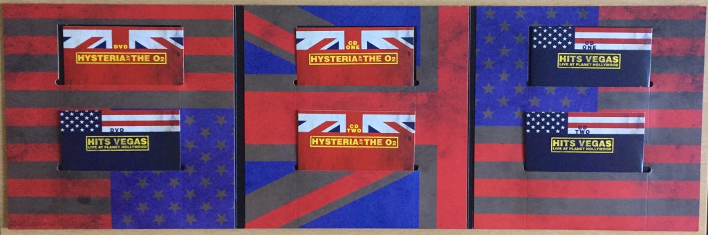 Large 3 panel foldout sleeve from the Def Leppard London To Vegas box set, with faded versions of the Union Jack and American flags across the background. Each panel has 2 cutout pockets 1 above the other, each housing a cardboard sleeve containing a disc. The left panel holds the 2 DVDs, while the central and right panels hold the CDs for the London and Vegas shows respectively, 2 CDs each.