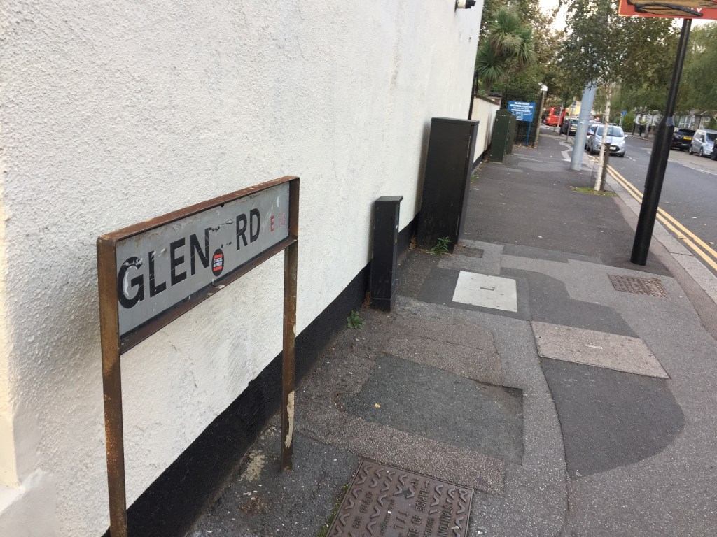 The entrance to Glen Road in E13, with a sign for Glen Road Medical Centre in the distance.