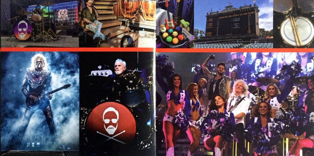 2-page spread from the Live Around The World album booklet by Queen and Adam Lambert. The left page shows Brian and Roger performing on the guitar and drums respectively, with Brian dressed in a metallic robot style mask and outfit. On the right page, Brian triumphantly plays his guitar surrounded by enthusiastic cheerleaders wearing very revealing blue and white outfits.