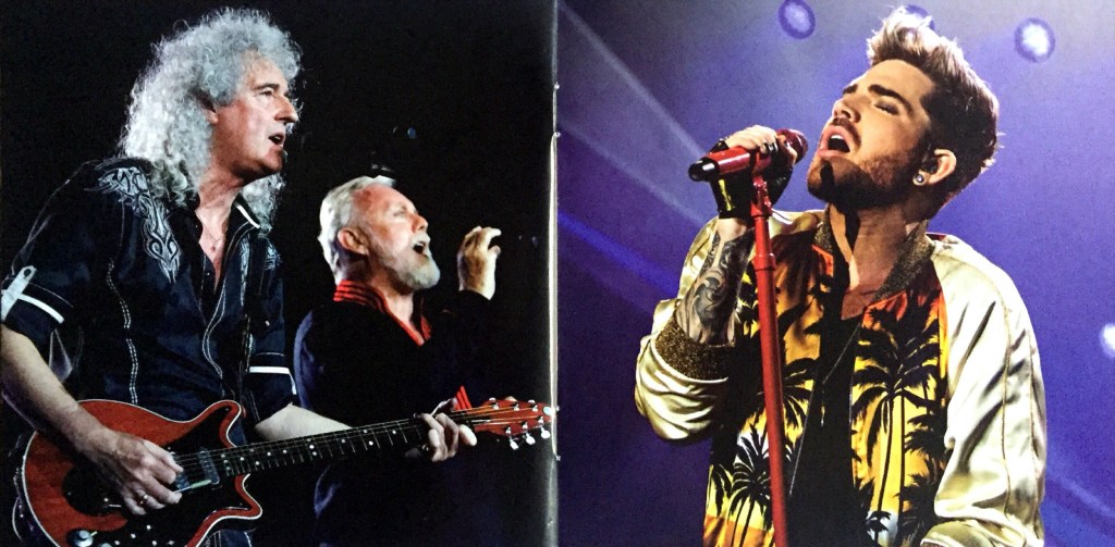2-page spread from the Live Around The World album booklet by Queen and Adam Lambert, showing Brian and Roger singing on the left page, and Adam singing on the right.