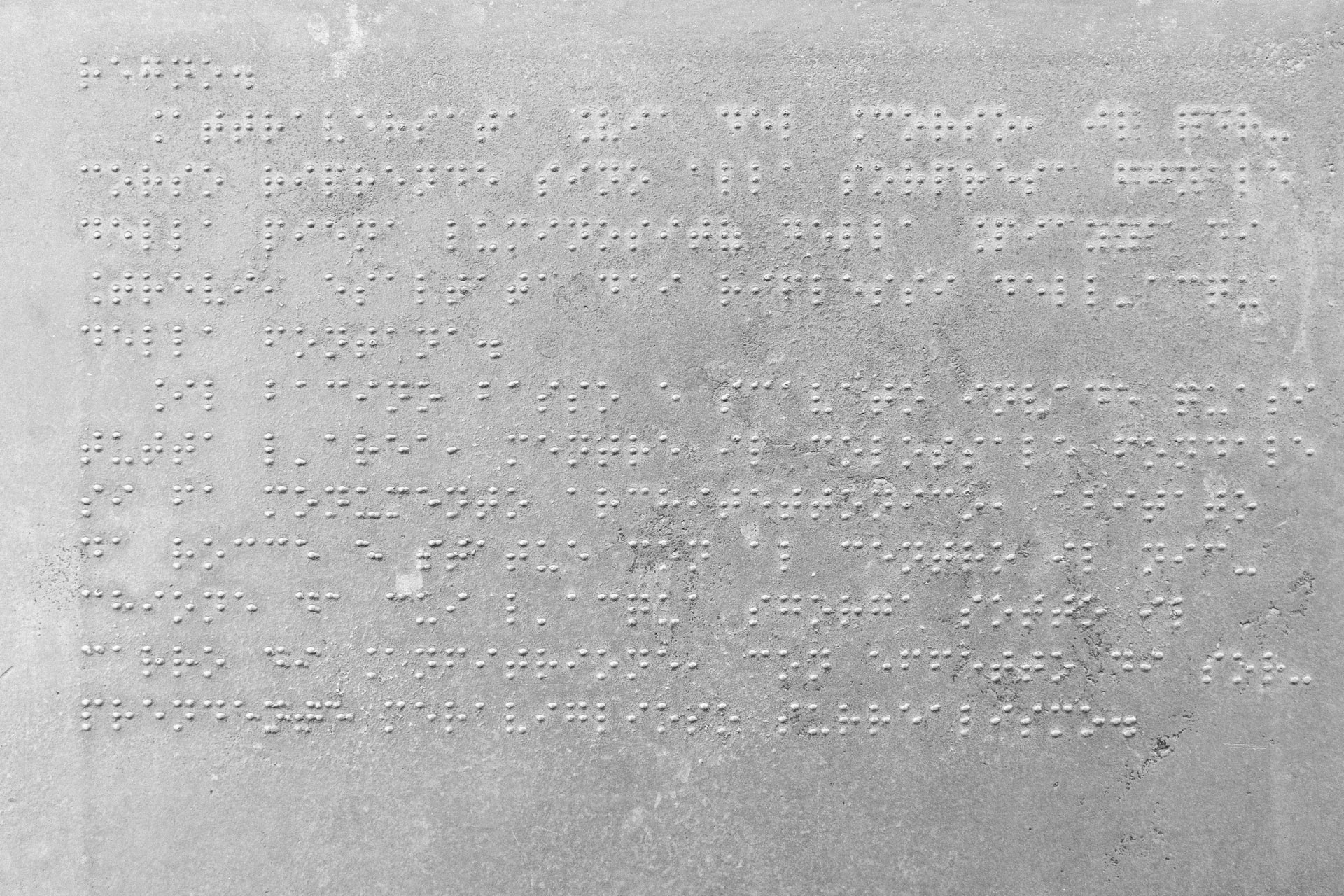 Sign in Braille explaining the history of the Trevi Fountain in Rome, Italy.