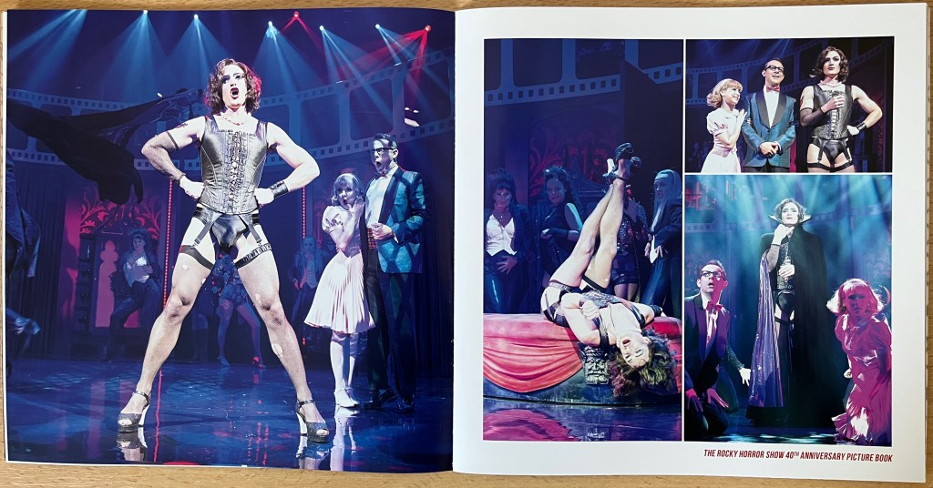 Double-page spread from the Rocky Horror 40th anniversary photo book. On the left, Brad and Janet's mouths are open in shock as Frank N. Furter stands proudly, legs apart and hands on hips, while wearing a leather corset, underpants, suspenders, stockings and high heels. On the right are 2 more photos of Frank with Brad and Janet, and one of Frank laying back with his legs in the air.