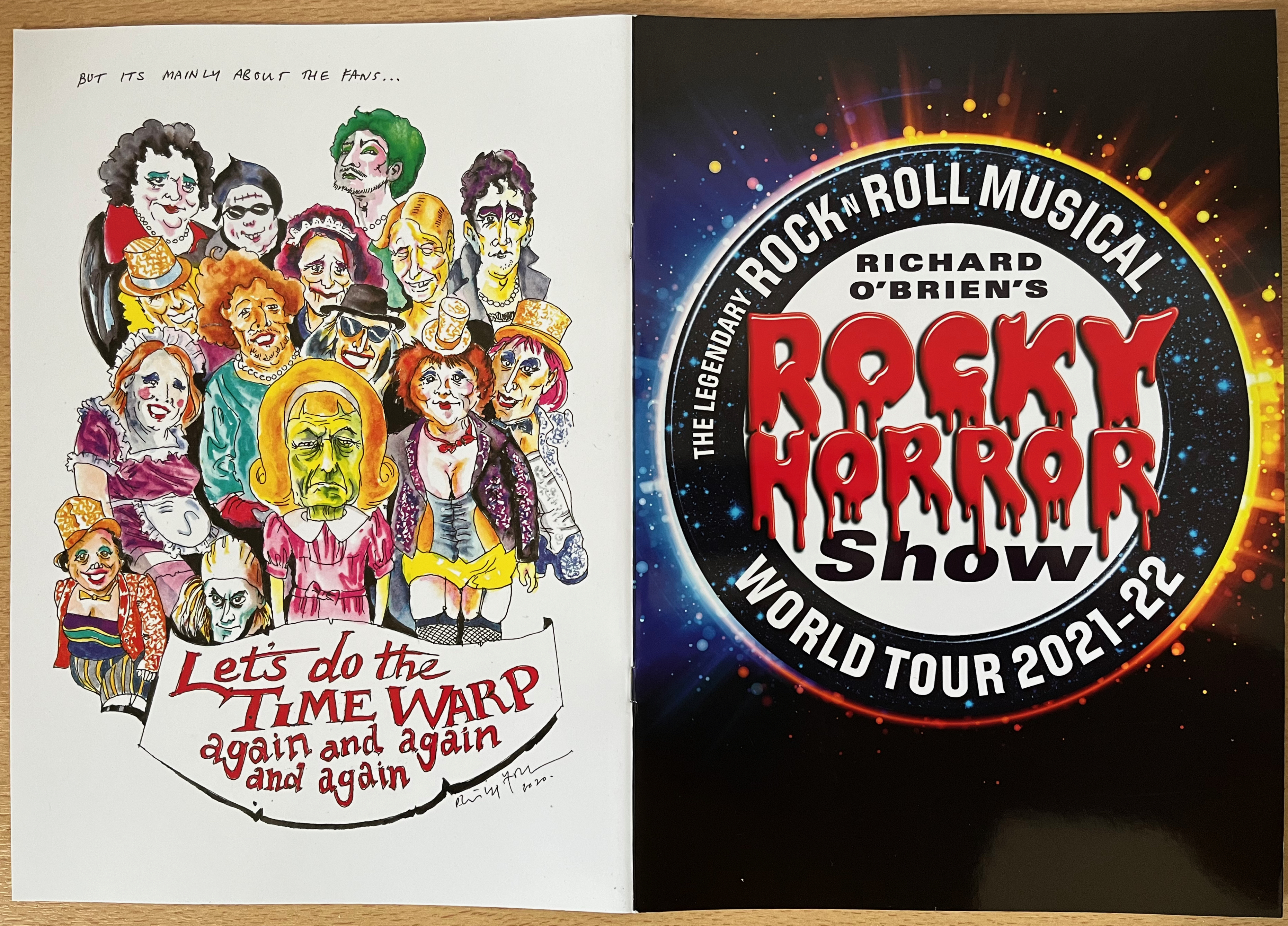 Cover spread of the brochure for the Rocky Horror World Tour 2021-2022. The front cover shows the title, with the words Rocky Horror in red blood-dripping letters. The back cover shows colourful drawings of all the characters, with the text Let's Do The Time Warp Again And Again And Again.