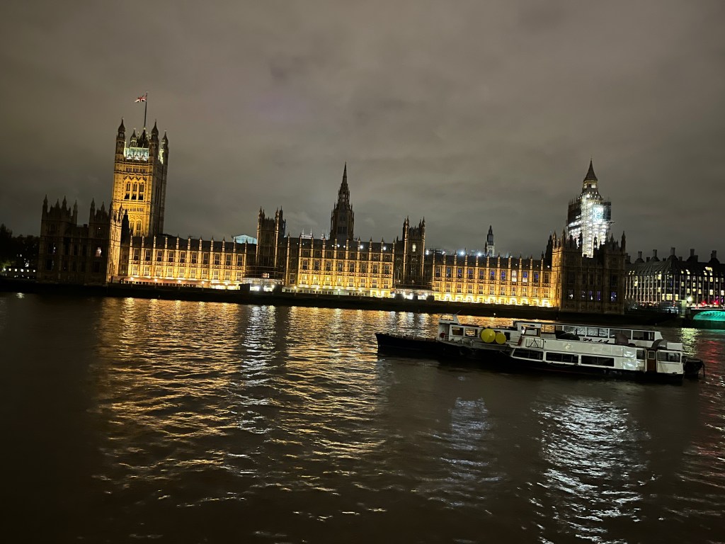 The Houses of Parliament lit up at night.