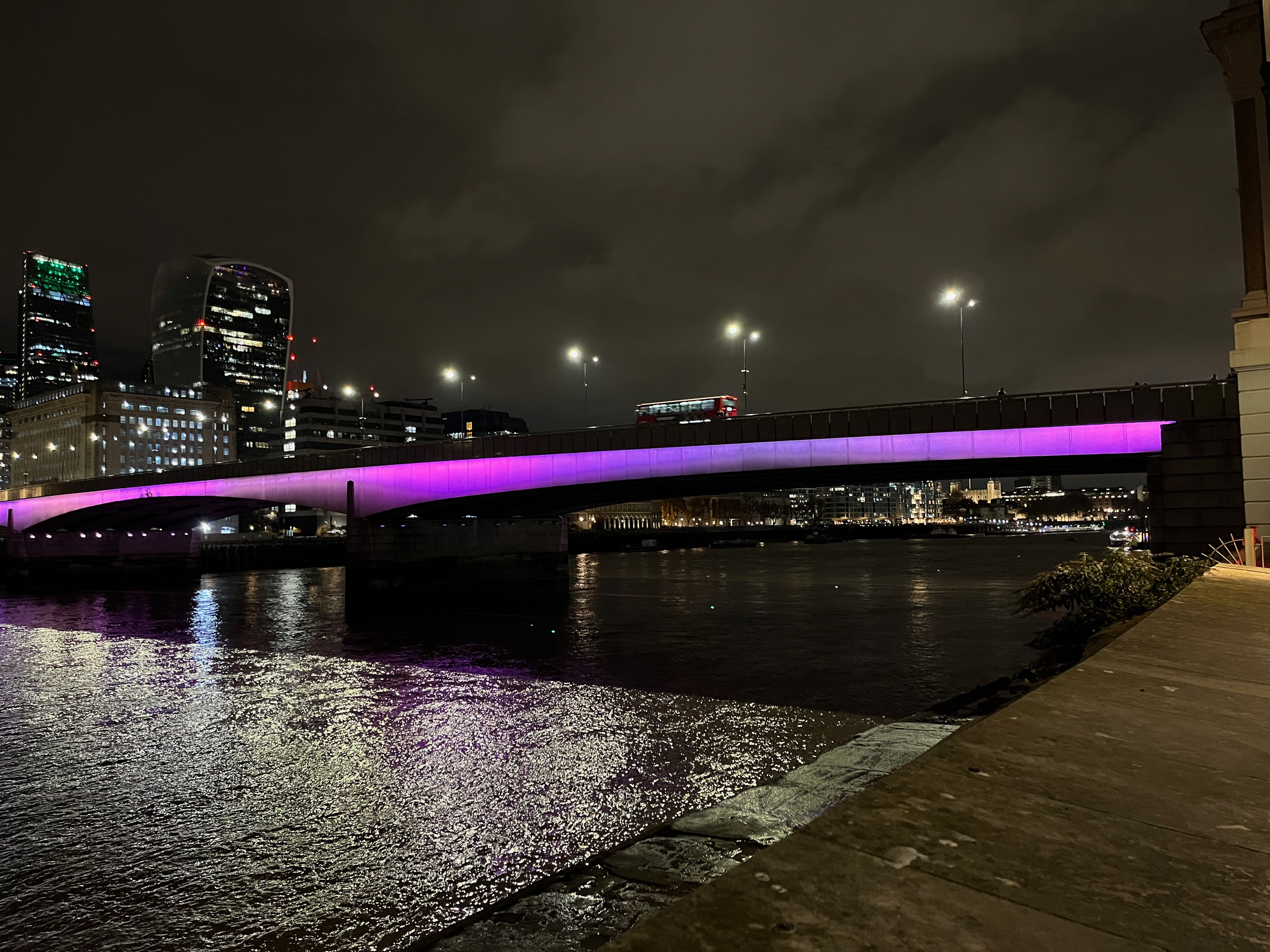 London Bridge, with purple light spanning its 2 wide arches.