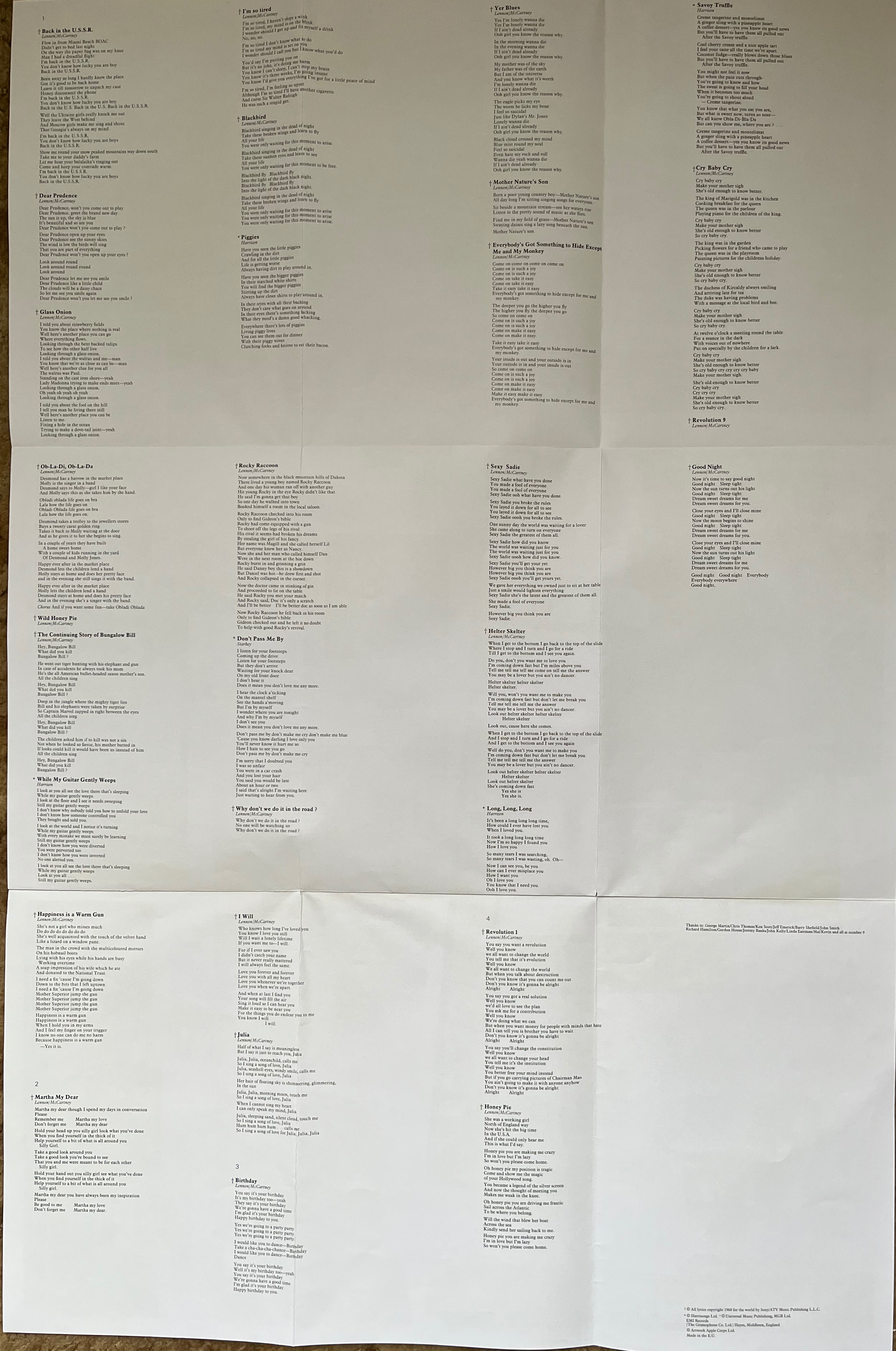 Large poster showing the lyrics to all the songs on the White Album by The Beatles.