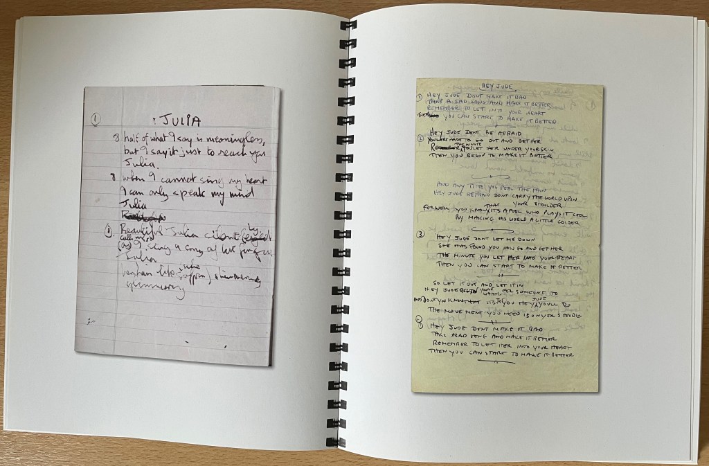 Double-page spread from the White Album box set book, showing hand-written lyrics for Julia and Hey Jude.