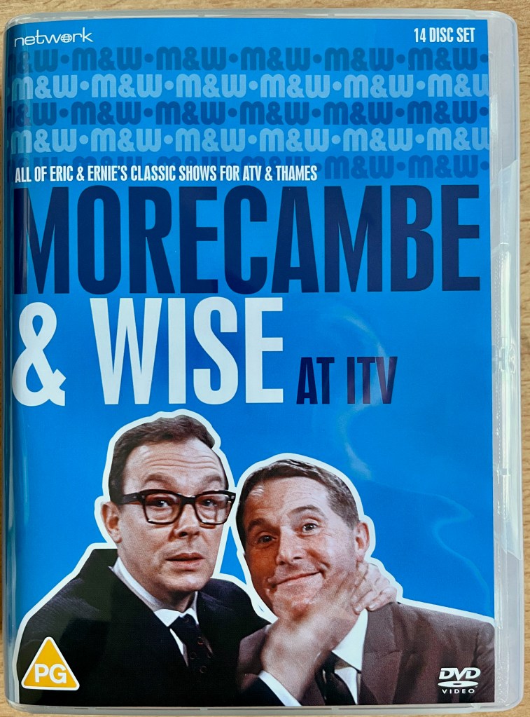 Cover for the DVD box set of Morecambe & Wise At ITV, showing the duo against a blue background.