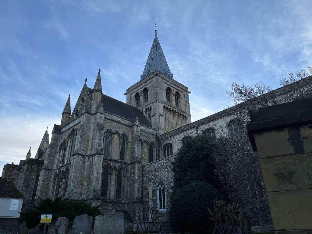 Rochester Cathedral, a large stone building with a tall spire.