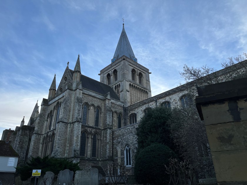 Rochester Cathedral, a large stone building with a tall spire.