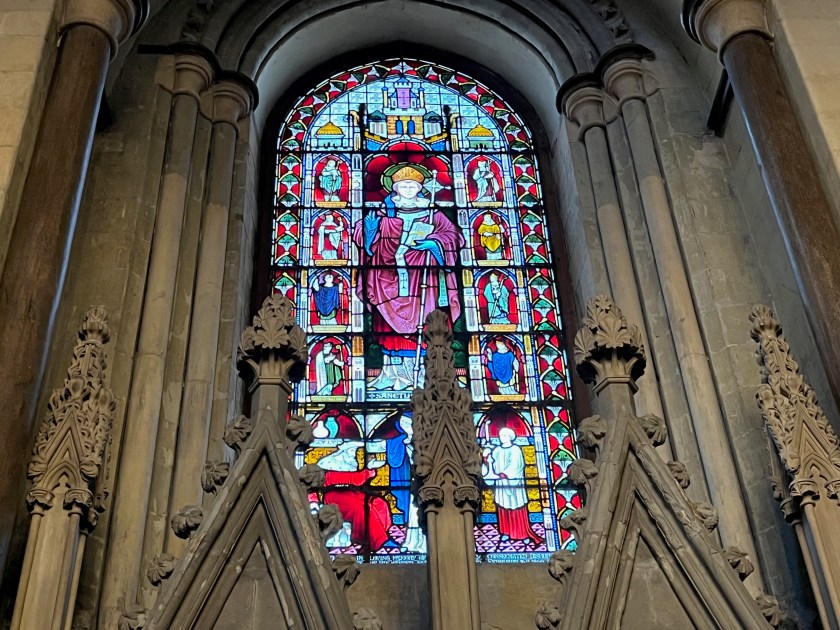 Large and colourful stained glass window depicting various religious figures.