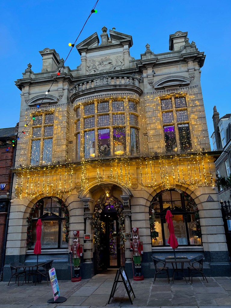 Lots of sparkling yellow lights adorning the window frames and over the archways of Café Nucleus.