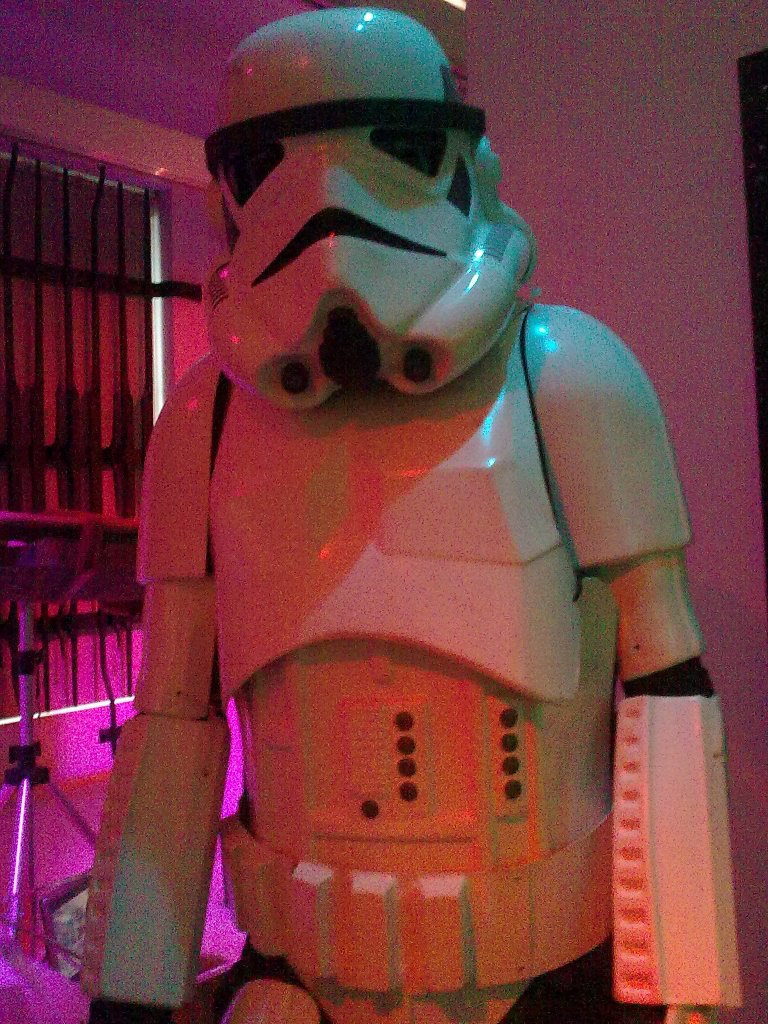Life-size model of a Stormtrooper from Star Wars, a tall soldier covered from head to toe in white armour.