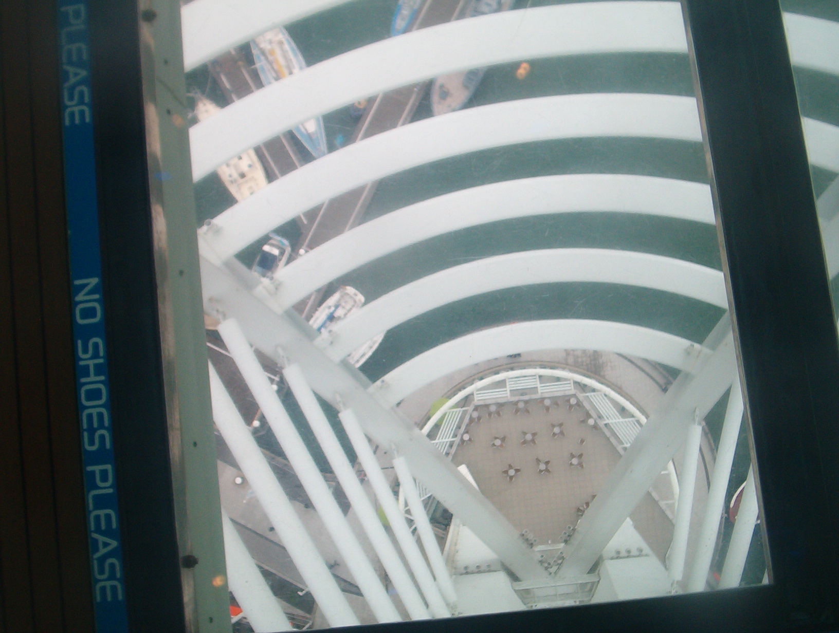View through the glass floor of Spinnaker Tower, looking at the ground floor below.