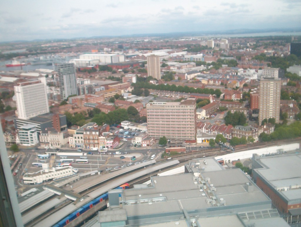 View from the Spinnaker Tower over the railway and tall apartment blocks.