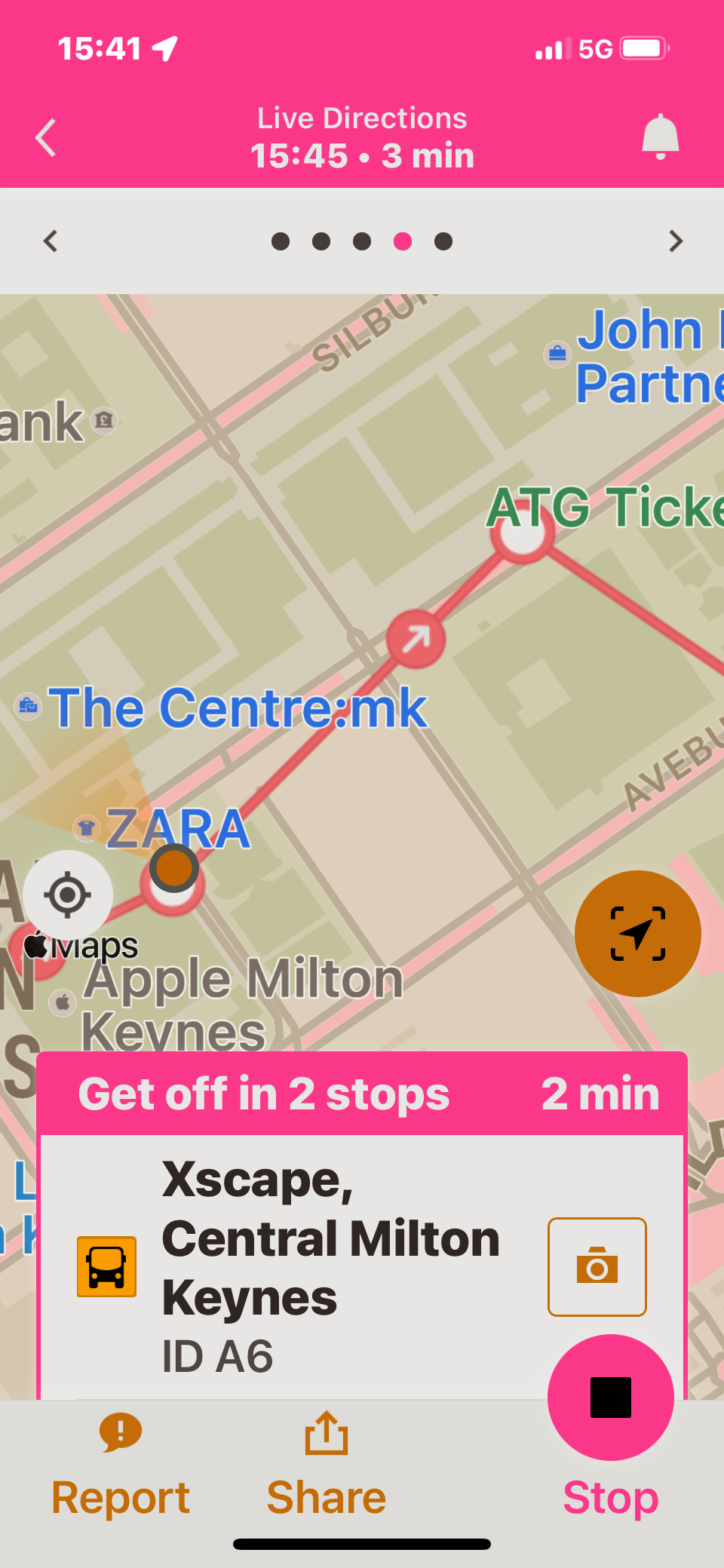 Moovit app screenshot, showing where we currently are in the bus route drawn on the map, and a line of text saying that I need to get off in 2 stops, in 2 minutes time.