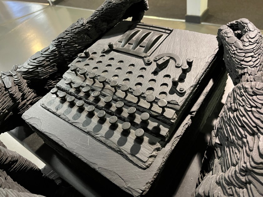 Close-up of the Enigma machine that forms part of the Alan Turing statue.