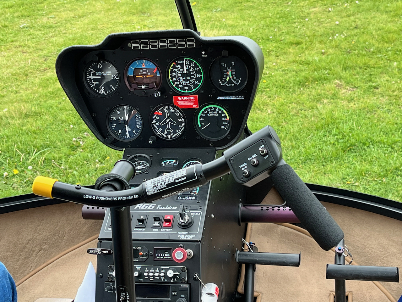 Close-up of the controls in the helicopter, including several dials and switches.
