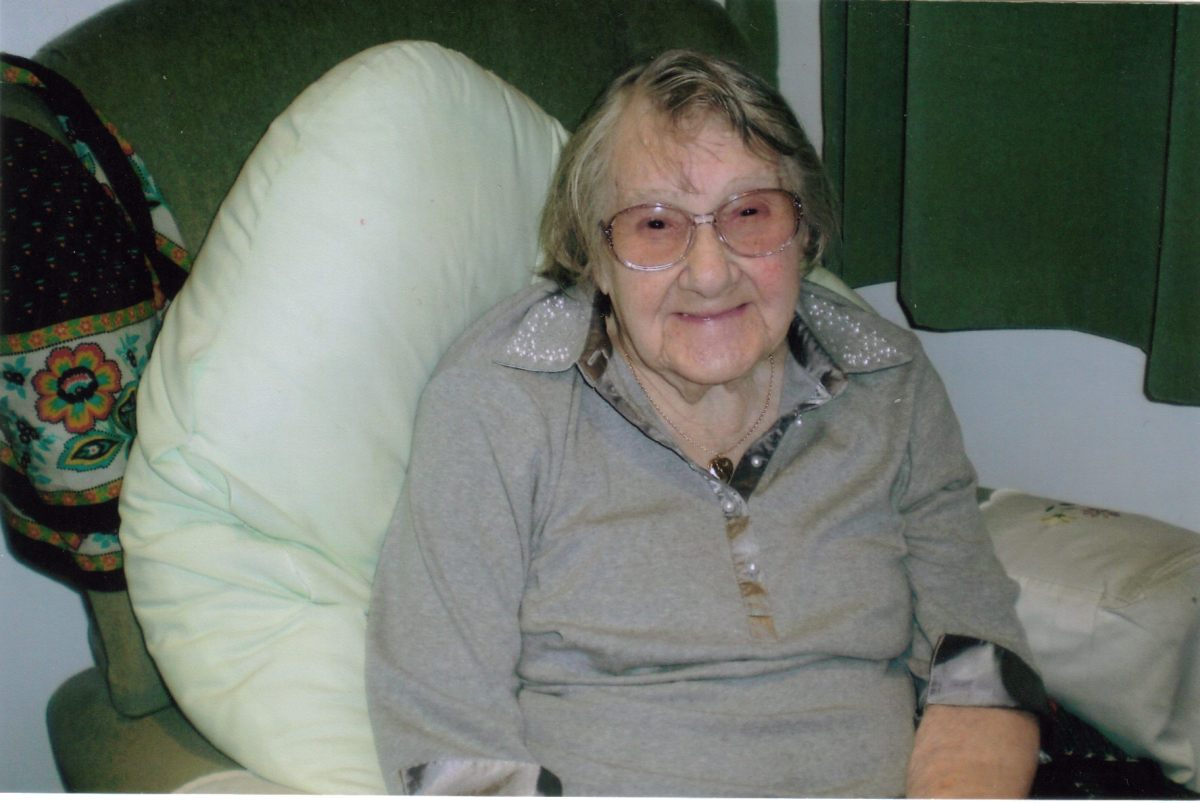My Nan, sitting in a chair and smiling, looking healthy at the age of 101 in 2008.