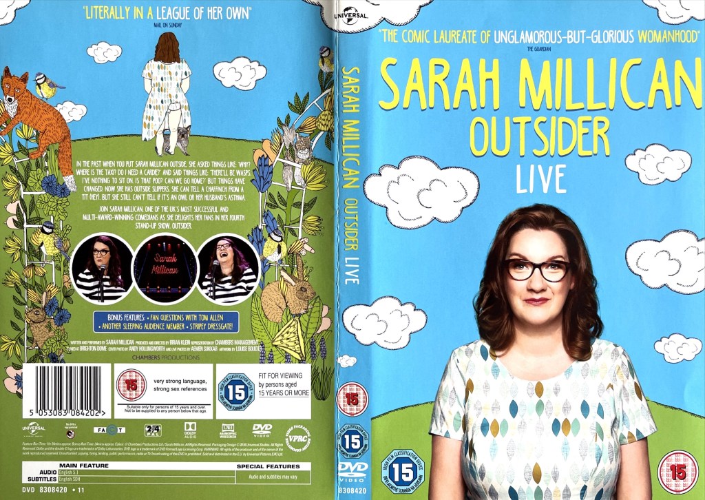 DVD cover for Outsider by Sarah Millican, showing her standing in front of a colourful drawing of a green hill, fluffy white clouds and a bright blue sky. She is wearing a white, short-sleeved, scoop-necked top, that has lots of different coloured leaf-like shapes arranged in lines across it.