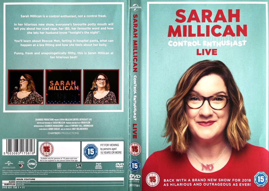 DVD cover for Control Enthusiast by Sarah Millican, showing a headshot of her against a turquoise background. She is wearing a red, scoop-necked top, revealing a necklace that has the word No in letters that are red and filled with white dots.