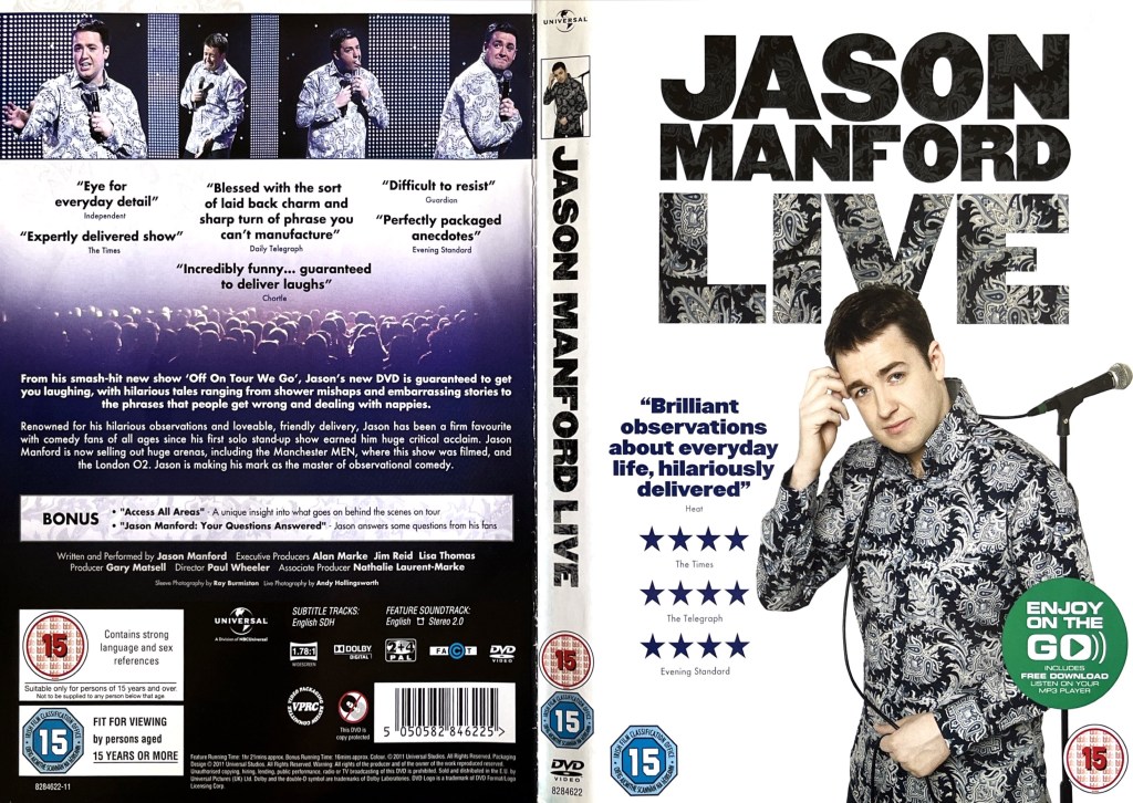 DVD cover spread for Jason Manford Live. The front of the sleeve shows Jason wearing a shirt that's black with a very detailed and elaborate leafy design on it. A cable is trailing over his shoulder, connected to a microphone on a stand behind him. The back cover shows a few images of Jason performing in the show above the details of the DVD.