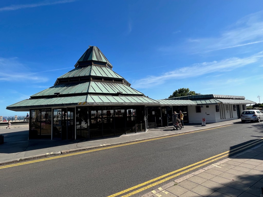 Ground level view outside the Leas Cliff Hall theatre, looking at the pyramid shaped roof.